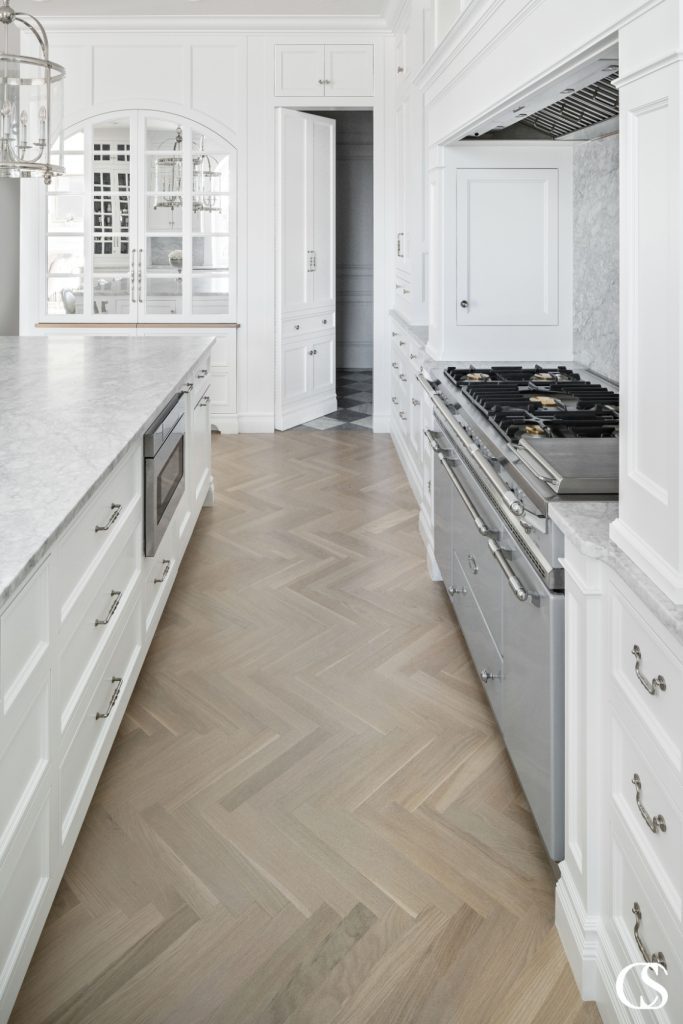One of the unique features of this custom oven hood is how seamlessly it blends with the rest of the cabinetry.