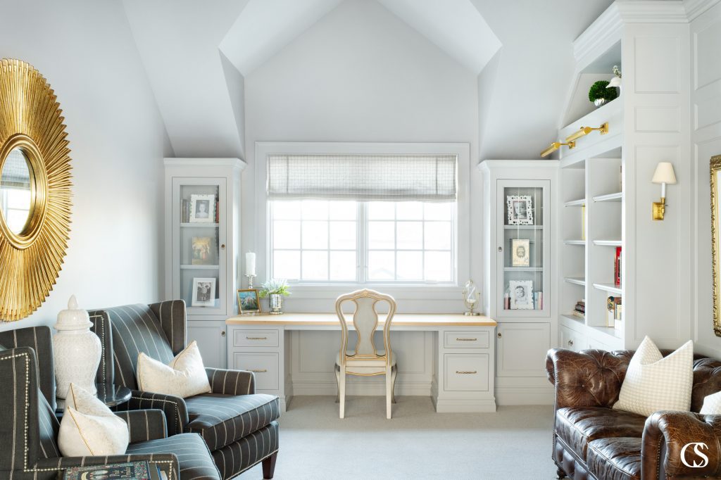 Don't forget about adding a little contrast when drawing up your built in desk ideas. The solid wood desktop not only creates a wonderful work space, but makes the custom cabinetry even more special.