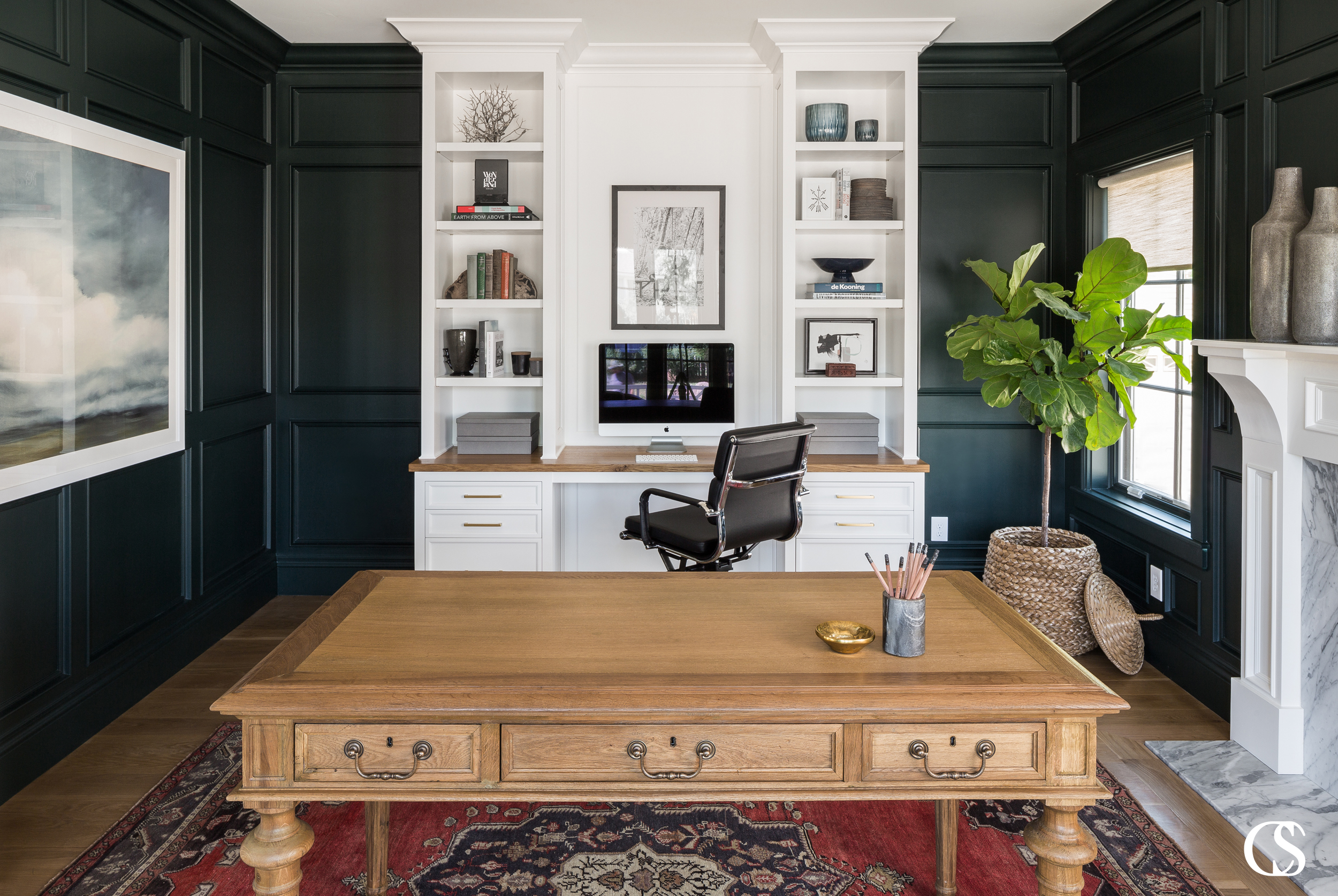 When designing your dream home office, make sure to include both open shelves for display items and drawers to hide away less attractive office supplies! For more of our best built in desk tips, check out the blog on ChristopherScottCabinetry.com!